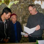 37 Mr. Mo in red hat, with young translator